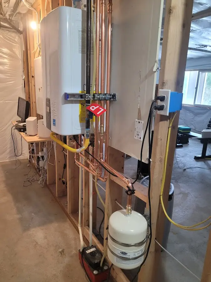 Licensed plumber repairing a kitchen sink in Chaffee